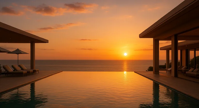Luxury resort infinity pool overlooking ocean at sunset, representing modern hospitality trends and exclusive membership experiences